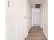 Clean hallway with new flooring and neutral-colored doors at 3833 W Woodridge Dr, Glendale, AZ 85308