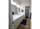 Elegant bathroom featuring a double vanity and updated fixtures at 2060 E Quartz St, Mesa, AZ 85213