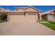 Two-car garage and attractive landscaping at 192 W Los Arboles Dr, Tempe, AZ 85284
