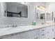 Elegant bathroom with dual sinks and a large vanity at 192 W Los Arboles Dr, Tempe, AZ 85284