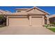 Tan two-story house with a two-car garage at 192 W Los Arboles Dr, Tempe, AZ 85284