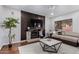 Living room features a fireplace and built-in entertainment center at 192 W Los Arboles Dr, Tempe, AZ 85284