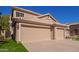 Two-story house with a three-car garage at 192 W Los Arboles Dr, Tempe, AZ 85284