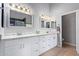 Bathroom boasts double sinks, quartz countertops, and elegant lighting at 192 W Los Arboles Dr, Tempe, AZ 85284