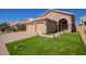 Two-story house with a two-car garage and walkway at 192 W Los Arboles Dr, Tempe, AZ 85284