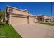 Three-car garage and a two-story house at 192 W Los Arboles Dr, Tempe, AZ 85284