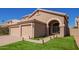 Two-story house with a two-car garage and walkway at 192 W Los Arboles Dr, Tempe, AZ 85284