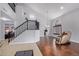Spacious living room with hardwood floors and staircase at 192 W Los Arboles Dr, Tempe, AZ 85284