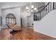 Bright and spacious entryway with high ceilings and elegant chandelier at 192 W Los Arboles Dr, Tempe, AZ 85284
