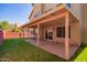 Covered patio with brick flooring and artificial turf at 192 W Los Arboles Dr, Tempe, AZ 85284