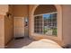 Front entry with arched window and security door at 192 W Los Arboles Dr, Tempe, AZ 85284