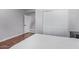 Well-lit bedroom with wood floors and a view of the upstairs hallway at 192 W Los Arboles Dr, Tempe, AZ 85284