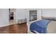 Bright bedroom featuring wood floors and ample closet space at 192 W Los Arboles Dr, Tempe, AZ 85284