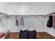 Large walk-in closet with ample hanging space and shelving at 192 W Los Arboles Dr, Tempe, AZ 85284