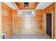 Small bathroom with wood walls and tiled floor at 2322 N 8Th St, Phoenix, AZ 85006