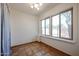 Small spare bedroom with tile floors and large window at 2322 N 8Th St, Phoenix, AZ 85006
