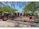 House with red door and a well-maintained yard, black metal fence at 2322 N 8Th St, Phoenix, AZ 85006