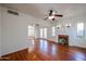Spacious living room with hardwood floors, a fireplace, and ceiling fan at 2322 N 8Th St, Phoenix, AZ 85006