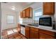 Kitchen with wood cabinets, tile floors, and stainless steel appliances at 2322 N 8Th St, Phoenix, AZ 85006