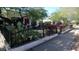 Charming house with lush landscaping, cacti, and a black metal fence at 2322 N 8Th St, Phoenix, AZ 85006