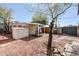 Large backyard with gravel, trees, and a storage shed at 2322 N 8Th St, Phoenix, AZ 85006