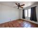 Spacious bedroom with tile floors, ceiling fan and window coverings at 2322 N 8Th St, Phoenix, AZ 85006