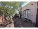 Backyard with mature trees and rock landscaping at 2322 N 8Th St, Phoenix, AZ 85006