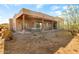 Covered patio with hammock and desert landscaping at 44811 N 12Th St, New River, AZ 85087
