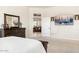 Spacious bedroom with large TV and dresser at 44811 N 12Th St, New River, AZ 85087