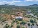 Aerial view showing a home's desert setting and surrounding landscape at 44811 N 12Th St, New River, AZ 85087