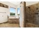 Bathroom with corner bathtub and walk-in shower at 44811 N 12Th St, New River, AZ 85087