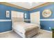Bedroom with full-size bed and large clock at 44811 N 12Th St, New River, AZ 85087