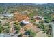 Aerial view of a home nestled in a desert landscape with mountain backdrop at 44811 N 12Th St, New River, AZ 85087