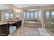 Luxurious bathroom with soaking tub, shower, and dual sinks at 3730 E Cat Balue Dr, Phoenix, AZ 85050