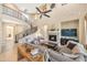 Spacious living room with a fireplace, high ceilings, and a curved staircase at 3730 E Cat Balue Dr, Phoenix, AZ 85050