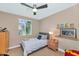 Charming bedroom with a single bed and built-in shelving at 3730 E Cat Balue Dr, Phoenix, AZ 85050