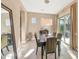 Bright dining room with a dark wooden table, and access to the backyard at 3730 E Cat Balue Dr, Phoenix, AZ 85050