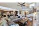 Living area with open floor plan, high ceilings and a view into the kitchen area at 3730 E Cat Balue Dr, Phoenix, AZ 85050