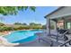 Expansive pool and spa with a covered patio and lounge chairs at 3730 E Cat Balue Dr, Phoenix, AZ 85050