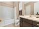 Clean bathroom with tub shower combo, vanity and decorative art at 3730 E Cat Balue Dr, Phoenix, AZ 85050