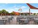 Community pool with tables, chairs, and shade structures at 3730 E Cat Balue Dr, Phoenix, AZ 85050