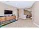 Bright hallway with a wooden media cabinet and staircase at 3730 E Cat Balue Dr, Phoenix, AZ 85050