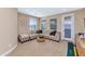 Cozy game room featuring a comfortable sectional sofa and putting green at 3730 E Cat Balue Dr, Phoenix, AZ 85050