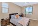 Bright bedroom with a comfortable bed and a window seat at 3730 E Cat Balue Dr, Phoenix, AZ 85050