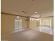 Spacious living room with tile flooring and large windows at 13607 W Springdale Dr, Sun City West, AZ 85375