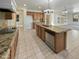 Island kitchen with granite counters, stainless steel appliances, and copper faucet at 2682 E Dublin St, Gilbert, AZ 85295