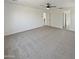 Large bedroom with ceiling fan and access to hallway at 2682 E Dublin St, Gilbert, AZ 85295