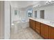 Elegant bathroom with double vanity and soaking tub at 2682 E Dublin St, Gilbert, AZ 85295