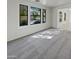 Spacious living room featuring large windows and grey carpeting at 2682 E Dublin St, Gilbert, AZ 85295