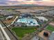 Aerial view of community amenities including pool, playground, and clubhouse at 16021 W Hackamore Dr, Surprise, AZ 85387